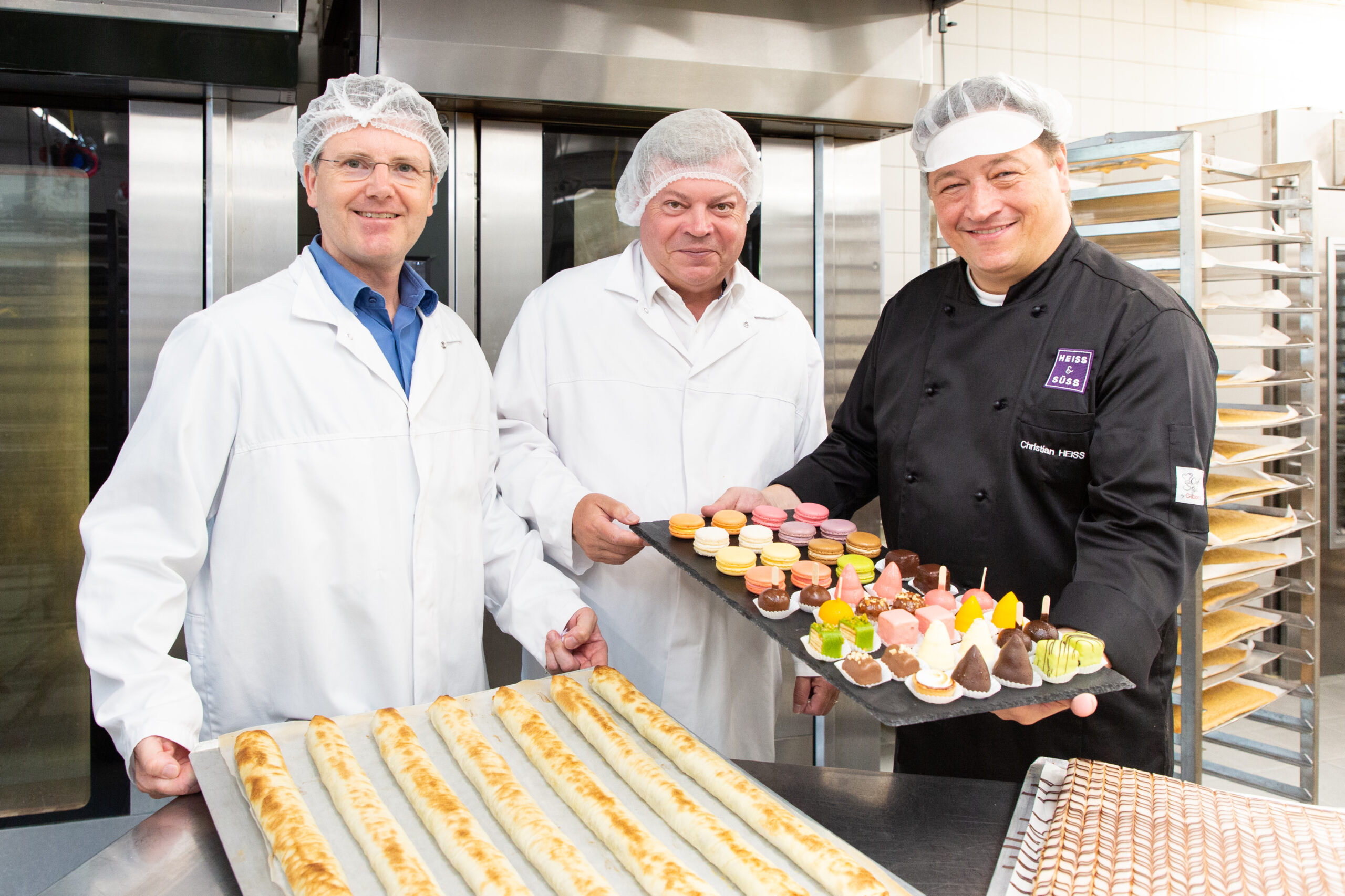 WBNÖ Direktor Harald Servus und Obmann der Fachgruppe Lebensmittelgewerbe zu Besuch bei Heiß und Süß am Foto.